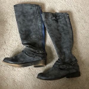 Gray, zip up riding boots.